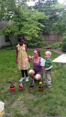 Andy painted a flower pot and planted a marigold