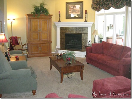 Red sofa couch, green chairs, white fireplace, pine TV cabinet, Living Room, gold walls