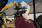 Oh, I get it, Sharkey!  The guys are using the very handy Hi-Lo machine to put up the......