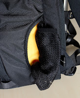 This pouch can be used to either carry a small bottle or it can also be used to carry a tripod which is also secured towards the top