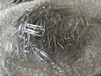 Oh boy!  A pile of paper clips!  Do you dare me to chain them together?  Wouldn't that be just maddening?  I'm tempted.