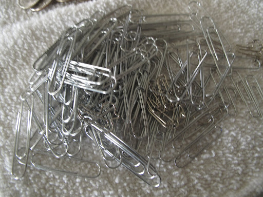 Oh boy!  A pile of paper clips!  Do you dare me to chain them together?  Wouldn't that be just maddening?  I'm tempted.