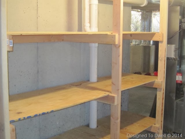 Added some storage shelves under the basement stairs and t…