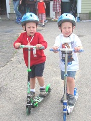 6.25.11 Kyle and Cody scooters