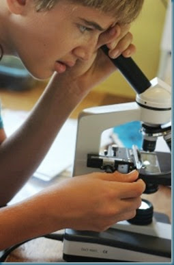 Benjamin looking through microscope 7-16