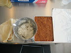 The process is easier if you set up your ingredients in an assembly line fashion in the order that you will be using them. Corn husks, prepared dough, filling and foil.