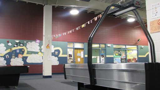 Air hockey is one of many invigorating activities provided for the children who come to Boys & Girls Clubs. (Photo by: Brittni Bynum)