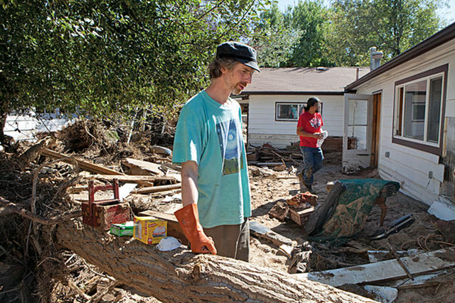 Musician David Tiller stands in the backyard of his destroyed recording studio and home that were in the path of the 2013 flooding in Lyons, Colorado. Photo: Melanie Stetson Freeman