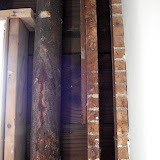 The cracked waste pipe in our living room wall, coming down from the second floor bathroom