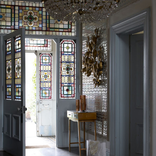 The beautiful stained glass almost negates the need to add anything to this entryway. (apartmenttherapy.com) The beautiful stained glass almost negates the need to add anything to this entryway. (apartmenttherapy.com)