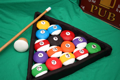 WHO WANTS TO BREAK?: Christian, aka Spot, producer of the Covino & Rich Show on Sirius XM Stars Too doesn't want to break on these billiard cupcakes. These are chocolate cupcakes and topped with Vanilla Fondant (dyed for the appropriate color.) The cue ball is made with a vanilla cupcake and topped with vanilla fondant.