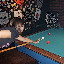 Paige showing off her billiards skills