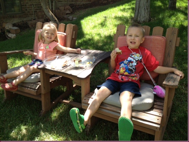 Chloe and Connor having lunch by pond