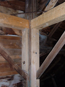 The new girts were free tenonned and three inch thick beech planks added support to prevent the new girts from rolling.  The iron dog was placed in the same position that we had found it.
