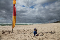 Sitting between the red and yellow flags