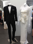 A peplum column dress is so sophisticated. It's shown with a new Vera Wang retail tux available at Men's Warehouse. The line is called Black by Vera Wang. A peplum column dress is so sophisticated. It's shown with a new Vera Wang retail tux available at Men's Warehouse. The line is called Black by Vera Wang.