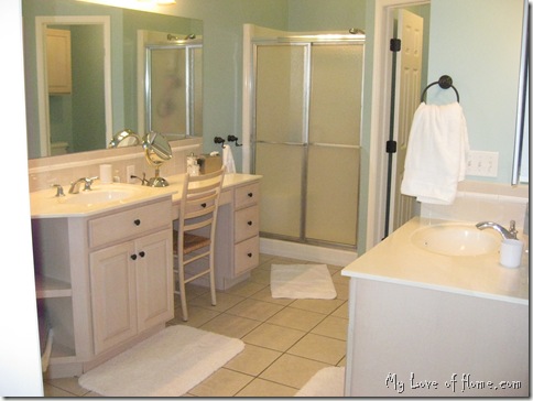 Spa bathroom, pale blue, white rugs, 