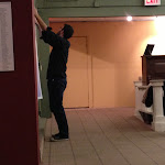 Sally Wippman and Brian Stojak put the finishing touches on the lobby display.