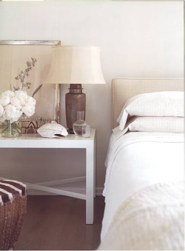 I am definitely loving the simplicity of lines and color in this bedroom - it looks so peaceful.  Big points for upholstering the headboard in raw-silk.