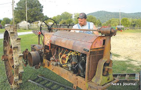 Man with old tractor 3x.jpg