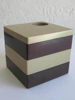 Brown and tan plastic desktop organizer cube
