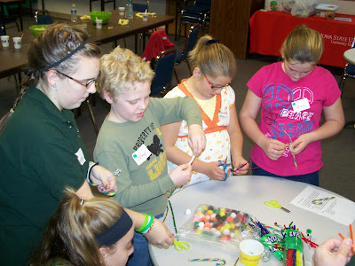 Youth gathered for the 4-H WONDERland event designed Christmas cards and made candy cane reindeer to deliver to residents in the nursing homes.    County council member Lauren Carter demonstrated some creative touches to attendees Joey Gatchel, Samantha Mellinger and Shalyn Kirk.  Photo courtesy:  Washington County Extension.