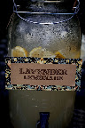 Lavender lemonade was kept cool in large jugs with custom signs. Lavender lemonade was kept cool in large jugs with custom signs.