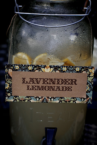 Lavender lemonade was kept cool in large jugs with custom signs. Lavender lemonade was kept cool in large jugs with custom signs.