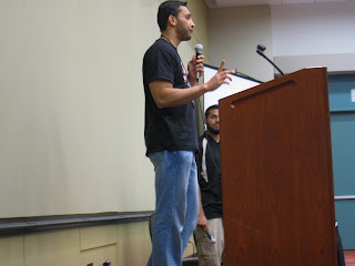 Br. Ali speaks while Br. Belal waits