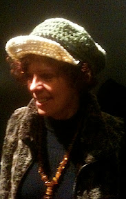 Lisa of www.sunddesignstudio@shaw.ca wearing a hat from my collection and her own original jewelery.
