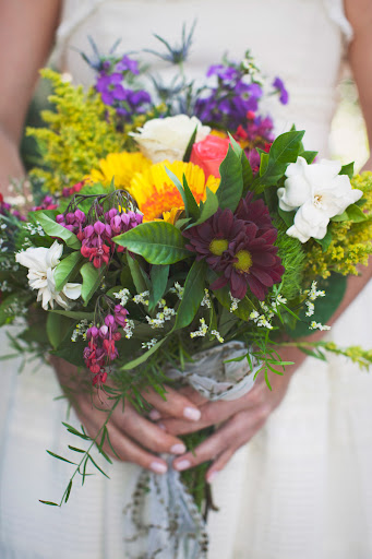 The night before her wedding, Tammany picked up a bunch of bright blooms from a local Whole Foods Market, and then staff at the Antebellum Guest House helped her arrange them into a vivid bouquet. The night before her wedding, Tammany picked up a bunch of bright blooms from a local Whole Foods Market, and then staff at the Antebellum Guest House helped her arrange them into a vivid bouquet.
