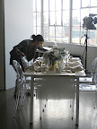 Katie sets the table.
