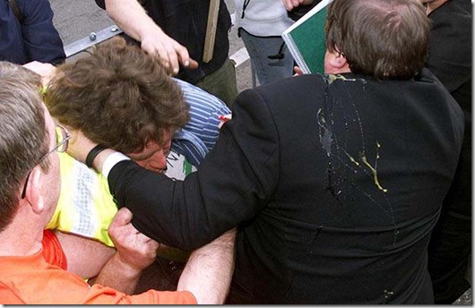 ELECTION Prescott 1...Deputy Prime Minister John Prescott is surrounded by protesters as he arrives at the Little Theatre, in the North Wales seaside resort of Rhyl Wednesday May 16, 2001, where he was to address a Labour Party rally. He was hit by at least one egg. See PA story ELECTION Prescott.  PA photo: Dave Kendall