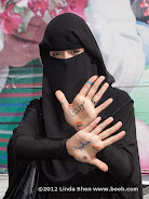 My friend Zainab proudly shows off the writing on her hands: "Our revolution is peaceful"