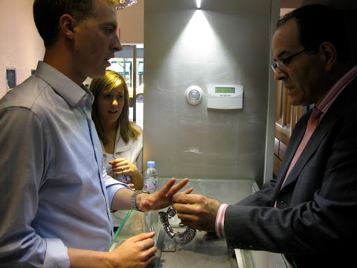The jewelry fitting Colin for his wedding band.