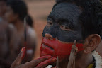Indigenous warrior paints his face before the occupation of Belo Monte dam construction site