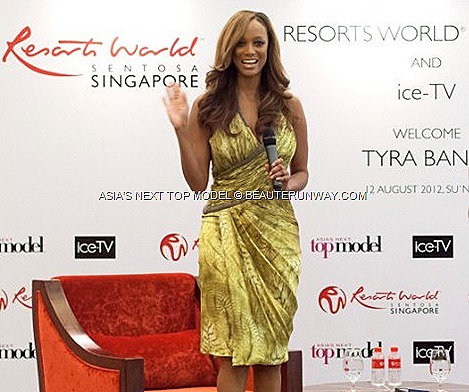 TYRA BANKS SINGAPORE ASIA’S NEXT TOP MODEL Supermodel IN  America’s Next Top Model creator, host executive producer EQUARIUS HOTEL RESORTS WORLD SENTOSA Carlos Miele bright yellow grey silk dress sky-high nude platform heels
