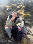 A handsome tramper is taking his break now