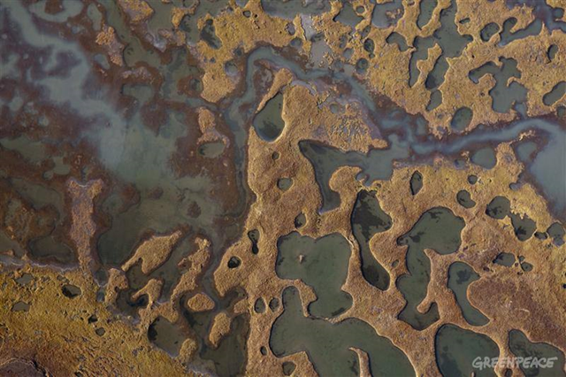 An aerial view of permafrost tundra in the Yamal Peninsula. The entire region is under heavy threat from global warming as temperatures increase and Russia&rsquo;s ancient permafrost melts. Photo: Steve Morgan / Greenpeace