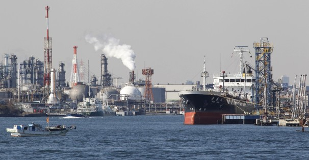 In this Feb. 20, 2012 file photo, an oil tanker is moored at an oil loading platform adjacent to an oil refinery in Kawasaki, west of Tokyo, as Japan posted a record high trade deficit in January after its nuclear crisis shut down nearly all the nation’s reactors for tougher checks, sending fuel imports surging. The Fukushima crisis is erasing years of Japanese efforts to reduce greenhouse gas emissions. Koji Sasahara / File / Associated Press
