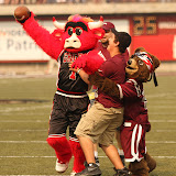 Benny the Bull and Lil' Mo play keep away from a ball boy at Saturday's game.  Benny the Bull held the role of Monte a few years ago before he made the move to the Chicago Bulls and is a familiar sight either on the field or the basketball court.  Washington-Grizzly Stadium in Missoula, MT, Sept. 22nd, 2012.