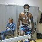 Excercise testing at Seneca, the sports science department of HAN
University in Nijmegen. Ethiopian Estifanos Gebresilassie from the Marco Polo Cycling Team at the bicycle ergometer. Team manager Gudo Kramer in the background. (photo: Nick Mitchell)