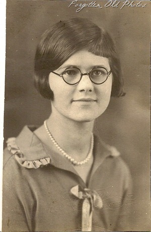 Girl with dark rimmed glasses