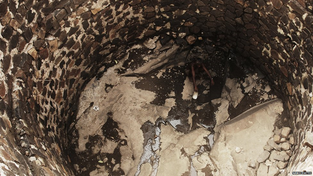 With wells almost completely dry in India's Mahashtra state, a trickle of water is all that many villagers have access to - even then they often have to wait for hours to collect a sufficient amount. Photo: Arko Datto / BBC