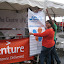 Lenita and Yudish putting up the JCI Curepipe Banner