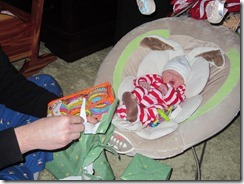 Daddy helping Zoey opening gifts2