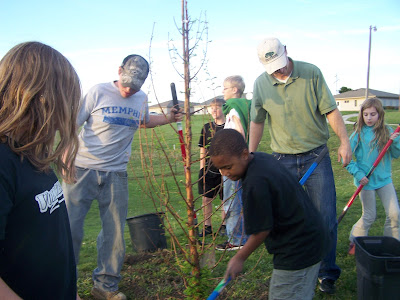 4-H Horse and Pony Club members learn how to plant trees from Dustin Hendrix, Trees Forever consultant (second from right).  Photo courtesy:  Washington County Extension.
