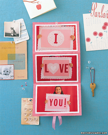 Photograph your children holding the signs, then let them tape the pictures to construction paper and fold the card accordion-style.
