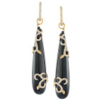 Swirled diamonds and gold complement the black onyx drops. Swirled diamonds and gold complement the black onyx drops.