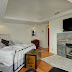 The master suite has a 2-sided fireplace, HDTV and sweeping water and mountain views.